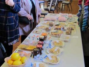 Table laden with home baking and handmade crafts